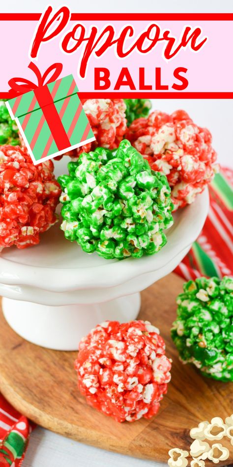 These Christmas popcorn balls are a must-try! Perfectly combining freshly popped popcorn, butter, and and homemade marshmallow, they're the ultimate snack. Popcorn Balls Christmas, Fun Christmas Party Snacks, Xmas Popcorn Balls, Christmas Popcorn Balls, Popcorn Ball, Christmas Baking Popcorn, Christmas Popcorn Balls Holiday Treats, Colored Popcorn Balls, Karo Syrup Popcorn Balls