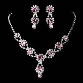 A gorgeous necklace with matching earrings featuring sparkling light rose crystals and clear rhinestones. Silver Necklace Prom, Pink Jewellery, Pink Jewelry Set, Crystal Wedding Tiaras, Bridal Earrings Drop, Bridesmaid Jewelry Sets, Light Rose, Silver Jewellery Sets, Wedding Bridal Jewellery