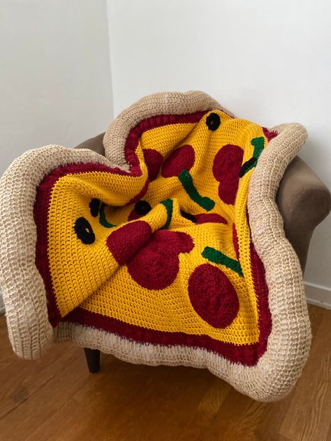 *Listing for premade, on hand pizza blankets only*   Included: 1 topping    Size: 43 inches Premade pizza blankets are an all time classic AND the most delectable gift for that pizza lover in your life! The Crochet Pizza Roadie is the ideal lap blanket for long car rides and serves as the perfect gift for ANY TIME of the year. Birthdays, housewarming, anniversary, holiday season, you name it, we have you covered... literally. Blankets take an average of 5-7 days to bake and deliver, so it's piping hot and ready to warm you up.  *This listing is for fresh and on hand pizza blankets only* Created with love from worsted weight yarn and recycled Poly-Fil. Averages 43" or greater due to the forgiving material.  *Made in a pet free, smoke free home.* Washing instructions:  1. Hand wash (preferre Crochet Apple Blanket, Unique Crochet Pillows, Car Crochet Blanket, Crochet Blanket Tapestry, Crochet Pet Blanket, Crochet Gift For Dad, Crochet Housewarming Gift, Blanket Yarn Projects, Crochet Gifts For Boys