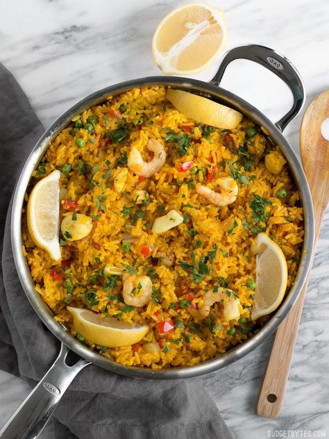 Seafood Rice Skillet is a nod to seafood paella using easy to find ingredients and equipment. Impress your dinner guests with this easy and impressive dish! BudgetBytes.com Shrimp And Rice Dishes, Frozen Salmon Recipe, Seafood Medley Recipes, Seafood Rice Recipe, Sunbasket Recipes, Shrimp Paella, Mixed Seafood Recipe, Seafood Medley, Pan Shrimp