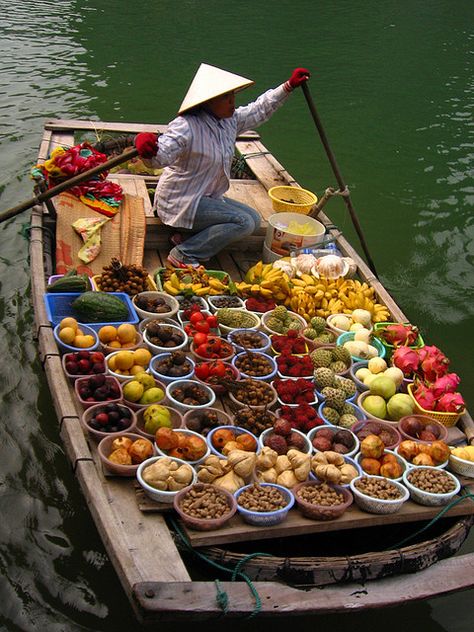 Taken in Halong Bay, Vietnam. These small boats came up to ours selling fruit. Surprisingly, some of the fruit sellers could speak Mandarin - guess they must get plenty of Mainland Chinese tourists here as well. It was 38C the day we were there so the fruit wasn't the freshest which is understandable but it certainly was colorful.. Halong Bay Vietnam, Vietnam Voyage, Halong Bay, Bhutan, Vietnam Travel, Mongolia, Iraq, Hanoi, Mexico City