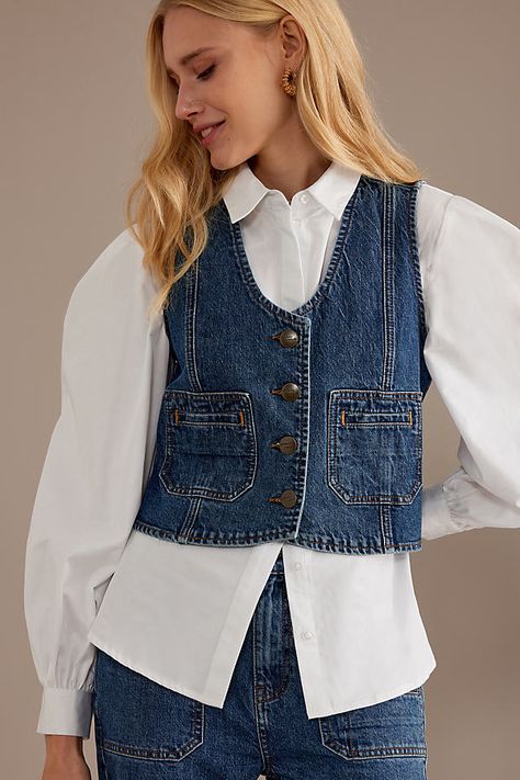 For an of-the-moment look imbued with Noughties nostalgia, style this Seventy + Mochi denim waistcoat with wide-leg jeans, Mary Janes, and a leather mini bag to match. | Bea Denim Waistcoat Jacket by Seventy + Mochi in Blue, Women's Size: Uk 12 at Anthropologie Denim Waistcoat Outfit, Denim Waistcoat Outfit Woman, Waist Coat Outfit, Waist Coat Outfit Women, Coat Outfit Women, Noughties Nostalgia, Waistcoat Outfit Women, Seventy Mochi, Jeans On Jeans