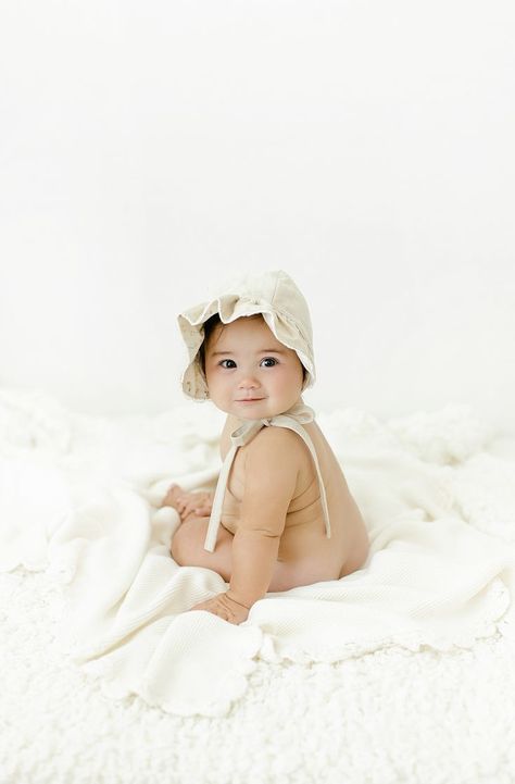 Smiling baby girl with dark hair wearing a bonnet sitting on a blanket 6 Month Girl Photoshooting, Girl 6 Month Shoot, 6 Month Studio Photoshoot, Baby Girl 6 Months Shoot, 8 Month Old Photoshoot, 6 Month Milestone Pictures, 10 Months Baby Photography, 6 Months Baby Photoshoot, 6 Month Old Photoshoot