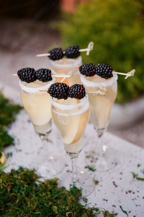 Champagne and Fruit: Sometimes a signature drink is more about the garnishes than the booze, like in the case of this champagne cocktail with slices of soaked pears in glass and skewered blueberries on top. Signature Cocktails Wedding, Wedding Signature Drinks, 카페 인테리어 디자인, Champagne Cocktail, Wedding Drink, Wedding Inspiration Fall, Signature Drinks, Wedding Cocktails, Signature Cocktail