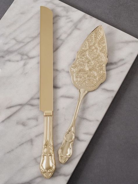 Elegance is best served with a sophisticated design. This shiny gold electroplated zinc and iron alloy cake knife and server set is timeless with classic handles and an ornate embossed server blade. It fits in with vintage, contemporary and eclectic décor making it perfect for weddings, parties and special occasions. Engraved in your choice of lettering style. Details: Size: The wedding cake knife measures 12 inches, and the cake server measures 9 inches long. Engraving Options: The Vintage Serv Rhinestone Wedding Cake, Wedding Knife Set, Wedding Cutlery, Wedding Cake Knife Set, Wedding Cake Server Set, Cake Knife Set, Wedding Cake Prices, Wedding Cake Servings, Boho Wedding Cake