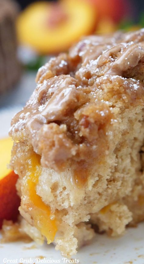 A close up photo of a piece of peach coffee cake on a white plate. Peaches Baked, Peach Coffee Cake, Pecan Streusel Topping, Peach Coffee, Classic Coffee Cake, Breakfast Coffee Cake, Cinnamon Glaze, Streusel Coffee Cake, Cinnamon Coffee Cake