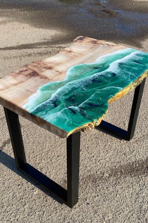 Оcean epoxy resin tables will fancy those who constantly miss the fresh ocean breeze when forever stuck behind the desk! Liven up those endless homeworking hours with this lovely epoxy table beautifully adorned with beach imagery. Being a perfect combination of natural wood and turquoise epoxy resin, these living room tables will always remind of celestial blue and white foamy waves crashing the golden shore every time you take a sip of coffee or have a home lunch break! Wood And Epoxy Table, Epoxy Decor, Resin Tables, Nautical Table, Resin Decor, Table Epoxy, Celestial Blue, Epoxy Table, Epoxy Resin Table