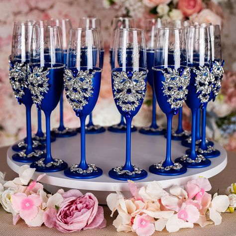 Make Your Quinceañera Celebration unique with Royal Blue Champagne Bottle and 4 Glasses Set - Ready to Be Filled with Joy, Best Quince Memories, and New Beginnings! Raise a toast to your journey to adulthood with a beautifully personalized Champagne Bottle and 4 Glasses, customized just for You. Set includes:~ bottle (empty) ~ 4 glasses.All the items are hand-made.Can be personalized with name and date of your celebration.We can decorate this set with any color or text you want. Royal Blue Champagne Glasses, Sweet 15 Party Ideas Quinceanera Blue, Royal Quinceanera Theme, Blue Silver Quinceanera, Blue Butterfly Quinceanera Theme, Royal Blue Quinceanera Ideas, Royal Blue Quinceanera Decorations, Wedding Color Royal Blue, Butterfly Quince Theme