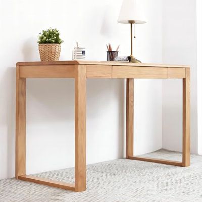 Introducing our all-wood desk, designed for both beauty and functionality. With rounded edges and sleek tapered legs, it offers both comfort and stability. Boasting ample storage and a solid oak construction, it's built to last. Enjoy the elegance and durability of traditional joinery with our mortise and tenon craftsmanship. Size: 29.53" H x 39.37" W x 19.69" D | Hokku Designs 47.24"Wood color solid wood rectangular desk Wood in Brown | 29.53 H x 39.37 W x 19.69 D in | Wayfair Small Desks For Small Spaces, Light Wood Desk Office Ideas, Wooden Desk Diy, Simple Wooden Desks, Simple Office Desk, Light Wood Desk, Tall Desk, Oak Wood Desk, Rectangular Desk