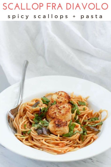 This easy recipe for scallop fra diavolo features sea scallops and pasta for an easy date night meal.  This pasta is tossed in a spicy red sauce, and the scallops are seasoned with red chili pepper, for an easy seafood dinner. #seafood #seascallops #datenight #pasta via @champagneta0249 Scallops And Pasta, Spicy Seafood Pasta, Scallop Recipes Pasta, Spicy Red Sauce, Easy Seafood Dinner, Scallop Pasta, Dinner Seafood, Fra Diavolo, Seared Scallops