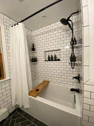 After 5 years, we finally updated our ugly master bathroom! : AmateurRoomPorn Tiled Tub Shower Combo Farmhouse, Subway Tile Shower Bath Combo, Big Bathtub Shower Combo, Bathroom Shower Ideas With Tub, Bathrooms With Tubs And Shower Combo, Small Bathroom Black Floor, Bath Tub And Shower Combo Ideas, Shower Tub Combo Remodel Small Baths, Tub Shower With Tile