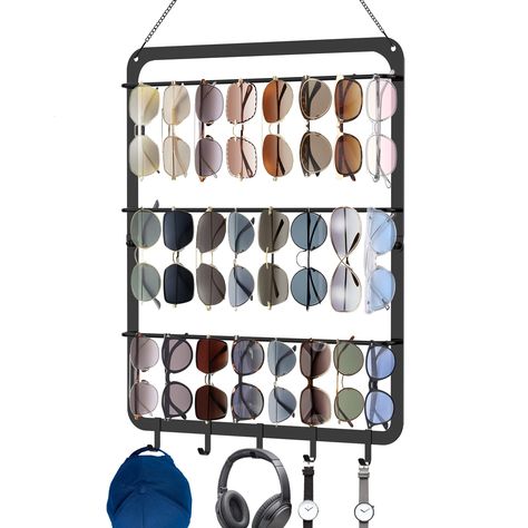 PRICES MAY VARY. 🕶【Upgraded 3 Tier Sunglasses Organizer with 5 Hooks】By upgrading to a 3-layer design plus 5 removable hooks, each tier can hold 8 pairs of sunglasses , our sunglass rack can hold a total of 29 pairs of glasses. The compact designed eyeglass rack has big storage capacity, you can easily organized all your sunglasses with it. 🕶【Sturdy and Reliable】Compared with other acrylic materials on the market, our sunglasses holder rack is made of high quality solid iron, using advanced po Sunglass Rack, Simple Sunglasses, Closet Storage Accessories, Eyewear Display, Sunglasses Organizer, Sunglasses Storage, Metal Frame Glasses, Metal Eyeglasses, Sunglasses Holder