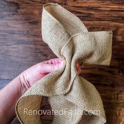 Burlap Bow Tutorial – The easy way to make burlap bows for wreaths and home décor. #burlapbowtutorial #diybow #burlapbow #renovatedfaith.com Making Burlap Bows, Burlap Angel, Burlap Bow Tutorial, Burlap Ribbon Bow, Easiest Burlap, Bow Making Tutorials, Burlap Wreath Diy, Homemade Bows, Cotton Wreath