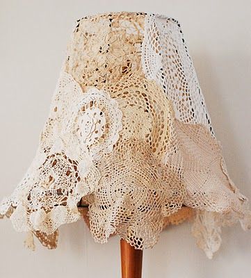 Doily Lamp Shade: For the lamp shade, remove the original fabric, leaving only the frame. Pin small doilies around the top, and then to one another, for a skirtlike effect. Remove pinned doilies. Machine-stitch together. Slip "skirt" over frame; hand-stitch around frame's top. Doily Lamp, Diy Doily, Shabby Chic Decorating, Crochet Lamp, Shabby Chic Lamp Shades, Doilies Crafts, Chic Lamp, Shabby Chic Lamps, Vintage Doily