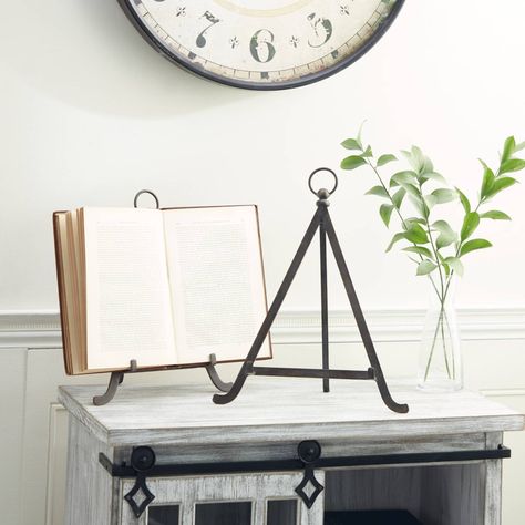 "Set of 2 Bronze Metal Traditional Easels Display your favorite art, favorite plates, or even favorite recipes on this display easel. Durable and sturdy, this easel lets you display your favorite things with ease, and with out overshadowing your piece. Use the pieces as bookstands in the living room altar or on the loft-style work area. This item ships in 1 carton. Suitable for indoor use only. This is a 2-in-1 set of metal easels with functional and decorative home use. Traditional theme. Item Living Room Altar, Room Altar, Table Top Display Stand, Tabletop Easel, Show Art, Metal Easel, Small Collectibles, Display Easel, Art Easel