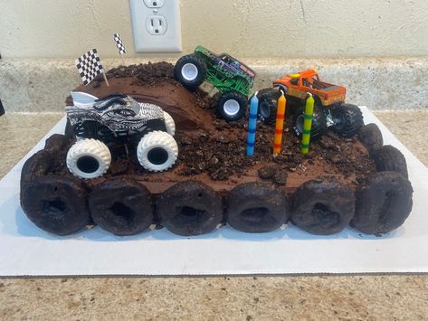 Monster Truck Bday Cake, Monster Truck And Dinosaur Cake, Monster Jam Cupcake Cake, Monster Jam Cupcakes Ideas, Monster Truck Dirt Cake, Monster Truck 3rd Birthday Cake, Monster Truck Birthday Snacks, Dinosaur Monster Truck Cake, Monster Truck Fruit Tray