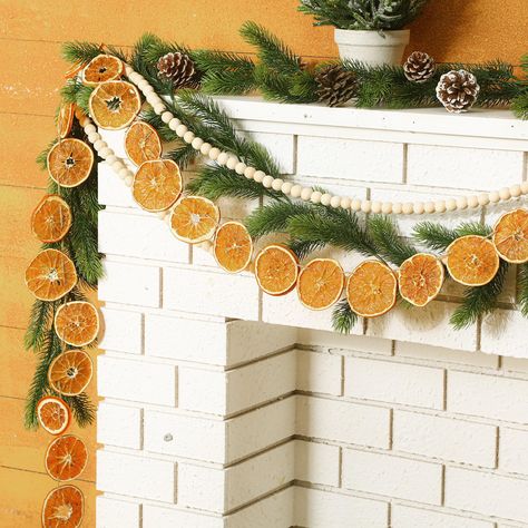 PRICES MAY VARY. Natural Decor for Celebrations: featuring a harmonious blend of dried orange slices, this 10ft long orange and wooden garland promises to enhanced your holiday decoration; The dried orange for Christmas offers a warm hue that brings a bright contrast to the snowy white outdoors, immersing your home in a cozy, festive ambiance Material: expertly crafted from dried and dehydrated orange slices and natural solid wood beads, this citrus garland is not only visually striking but also Winter Lemon Decor, Lemons Christmas Decor, Lemon Mantle Decor, Mustard Yellow Christmas Decor, Lemon Christmas Decor, Lemon Christmas Tree, Lemon Garland Decor, Yellow Christmas Aesthetic, Yellow Christmas Decor