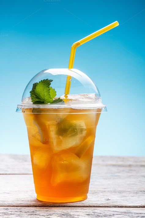 Check out Fresh ice tea by Grafvision photography on Creative Market Ice Tea Photography, Lemon Ice Tea, Homemade Orange Juice, Resep Koktail, Ice Lemon Tea, Orange Juice Recipes, Orange Juice Drinks, Raspberry Iced Tea, Iced Tea Maker