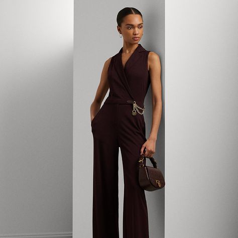 Made with stretch jersey for a smooth hand and ease of movement this sleeveless jumpsuit is defined by a surplice neckline and a wide-leg silhouette. Designed with notch lapels this elegant style is decorated with a glistening curb-link chain and an “LRL”-engraved padlock charm at the waist. Ralph Lauren Jumpsuit, Jersey Jumpsuit, Surplice Neckline, Pinot Noir, Sleeveless Jumpsuits, Ralph Lauren Womens, Wide Leg Jumpsuit, Vest Dress, Jeans Denim