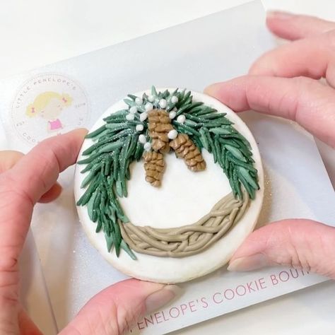 Victoria Jones | Decorated Sugar Cookies | Keller, TX on Instagram: "A rustic winter wreath decorated cookie! Take a close look towards the end and see if you can spot the change I made! • • • Colors and Diamond Dust from @thesugarart • • • #wreathcookies #wintercookies #winterwreath #decoratedcookies #royalicingart #cookietutorial #cookiedecorating #cookiedecoratingvideo #cookiesofinstagram #customcookies #realtorcookies #housewarmingcookies #designercookies #dfwcookies #cookiedecoration #cookievideo #cookieoftheday" Wreath Cookies Decorated Royal Icing, Pine Cone Cookies Decorated, Wreath Sugar Cookies Decorated, Sugar Cookie Wreath Royal Icing, Royal Icing Wreath, Christmas Wreath Sugar Cookies Decorated, Wreath Cookies Decorated, Wreath Sugar Cookies, Round Christmas Cookies Decorated Buttercream