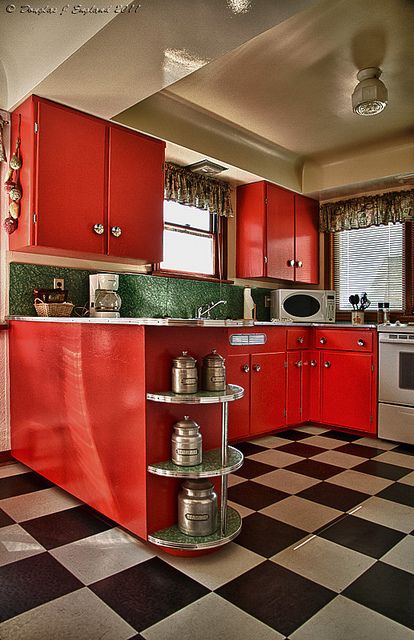 Lovely red kitchen with black-and-white tiled floor... Black White Red Kitchen, Red Retro Kitchen, Black And White Floor Kitchen, Black And Red Kitchen Ideas, Black White And Red Kitchen, Black And White Tile Kitchen, 50s Diner Kitchen, Red Kitchen Design, Red And Black Kitchen