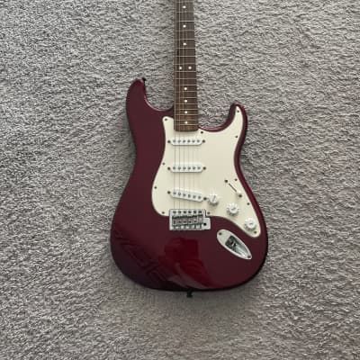 This is a used 2002 Fender Stratocaster set up and intonated for 10s-46s. Plays and works well. The body has a few light dings and scuffs, no major... Stratocaster Guitar Aesthetic, Fender Stratocaster Aesthetic, Stratocaster Aesthetic, Base Guitars, Brown Electric Guitar, Aesthetic Guitar, Kat Stratford, Guitar Aesthetic, Red Electric Guitar