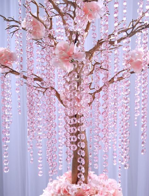 Crystal garland, light pink, length 1 meter. Crystal ball's diameter 18 millimeters. Have a stylish wedding with this stunning crystal garland. It can be used in many ways like decorating a floral display, create a crystal curtain, have a center piece wishing tree, decorate the table Each garland is 1m long and the diameter of each crystal ball is 18mm. Find out more Here. https://www.etsy.com/shop/CraftWanted?ref=seller-platform-mcnav&section_id=31049315 Butterfly Wedding Centerpieces, Crystal Wedding Decor, Pink Christmas Lights, Cherry Blossom Theme, Crystal Curtains, Light Up Tree, Crystal Garland, Tree Centerpieces, Wishing Tree