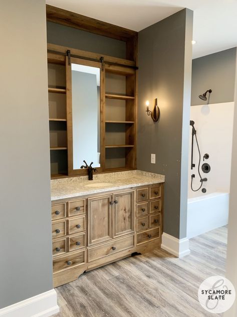 Beautiful vanity with a sliding "barn door" mirror and shelving behind it for lots of storage - there is also a hidden drawer in the toekick that opens up to make a step stool for shorter kiddos! Vanity Behind Bed, Hidden Step Stool, Barn Door Mirror, Restroom Ideas, Secret Drawer, Mudroom Cabinets, Beautiful Vanity, Sliding Mirror, Kids Beds