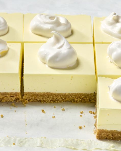 angled shot of a bunch of slices on parchment paper, topped with whipped cream Lemon Fluff Dessert, Fridge Desserts, Refrigerator Desserts, Lemon Fluff, Baking Bars, Cook Desserts, Texas Caviar, Fluff Desserts, Dairy Desserts