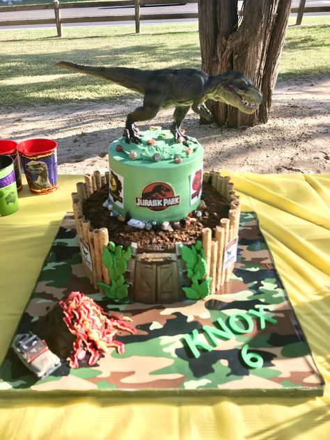 Jurassic Park dinosaur cake, with mini volcano cake and Pirouettes and edible images for the signs and door. Dinosaur Volcano Cake, Dinosaur Cake Ideas, Mini Volcano, Jurassic Park Cake, Dino Cakes, Dinosaur Jurassic Park, Jurassic World Cake, Festa Jurassic Park, Jurassic Park Birthday Party