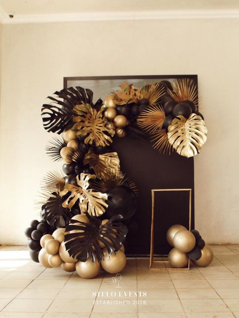 Black And Gold Tropical Party, Classy Tropical Theme Party, Black And Gold Party Backdrops, Elegant Tropical Party Ideas, Green Gold And Brown Party Decor, Black Gold Event Decor, Birthday Decor Classy, Black And Brown Party Theme, Sophisticated Party Decor