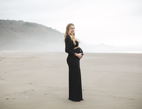 This mom-to-be looks radiant in a long sleeve, black maxi dress accented with a gold belt for a hint of sparkle Beach Maternity Shoot, Faux Fur Coat Black, Long Sleeve Black Maxi Dress, Maternity Photography Beach, Winter Maternity Photos, Beach Maternity Photos, Maternity Black Dress, Winter Beach, Maternity Inspiration