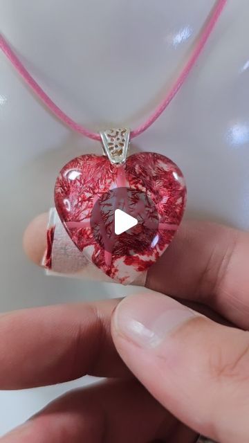 Daniel Cooper on Instagram: "The Blood Heart ❤️  Making a blood heart resin jewelry pendant with a heartbeat.  The growing vein stuff is Frost Paint from Vallejo.  The red is alcohol ink, NOT REAL BLOOD! The FAKE plaster is also just red alcohol ink on tissue with tape wrapped around it 😂 Let's see how many people do not read the description 😉😂  Resin jewelry, resin jewellery, resin art, resin, jewelry making, jewellery making  #resinart #resin #jewelrymaking" Resin Ink Jewelry, Resin Heart Pendant, Red Alcohol, Resin Jewelry Pendants, Jewellery Resin, Blood Heart, Alcohol Ink Jewelry, Heart Resin, Alcohol Ink Crafts