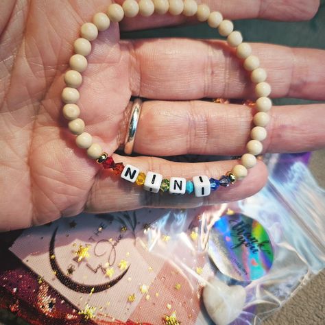 Just mailed this custom bracelet. She ordered from my website the "Custom Word Alphabet Bracelet", chose creamy fossil jasper beads, her word (NINI), and then emailed me to request the colors of the chakras. So cute, right? Get yours here: https://www.breathebyjosie.com/products/custim-word-alphabet-bracelet (Yes, I spelled "custom" wrong when I created the listing 😬) Alphabet Bracelet, The Chakras, Custom Bracelet, Jasper Beads, Custom Bracelets, My Website, Fossil, Chakra, So Cute