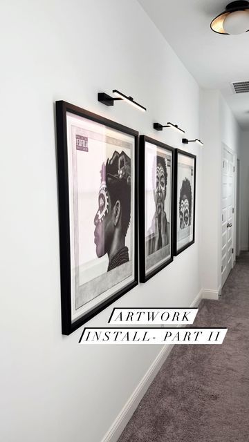 Black Art In Living Room, Art Gallery Wall With Lights, Frames On Wall With Lights, Wall Lights Over Pictures, Art Wall With Lights, Artwork With Light Above, Amazon Picture Light, Lights Over Artwork, Wall Lights For Pictures