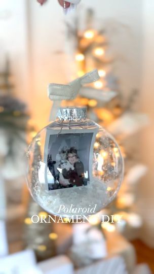 4 comments | Last year’s Polaroid ornament DIY turned out so magical! We did this craft at our extended family Christmas party and it was a big hit! ❤️🎄🤓 It uses Dollar Tree’s clear bulbs & filler… Comment “me” for the link to our DIY tutorial reel & Amazon camera link! Christmas decor Amazon Christmas Holiday reels Decoration ideas DIY tutorial Christmas diy Christmas Luxury lifestyle Black Friday Cyber Monday #polaroid #vintage #christmasornaments #diyornaments #ad #amazon #amazonfinds #christmasdecor #christmastime #itsthemostwonderfultimeoftheyear #glamchristmas #glamchic #farmhousechristmas #farmhousechristmasdecor #modernfarmhouse #modernfarmhousevibes | Twin Birdies, Amber Antozak & Aimee | John Debney · Main Title Polaroid Ornament Diy, Diy Picture Christmas Ornaments, Diy Christmas Ornaments With Pictures, Polaroid Christmas Ornament, Picture Ornaments Diy, Diy Picture Ornaments, Polaroid Ornament, Luxury Lifestyle Black, Amazon Camera