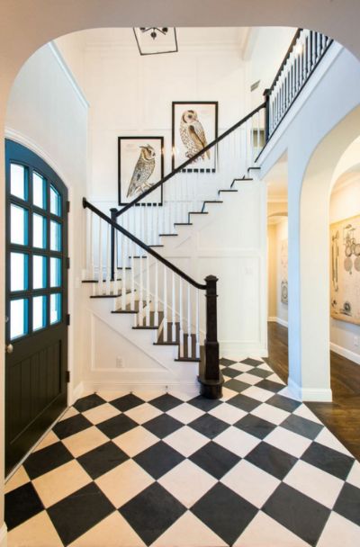 31 Houses With Black Front Entry Door Ideas - | Sebring Design Build Black And White Hallway, Classic Carpet, Wood Stair Treads, Carpet Staircase, White Hallway, Entryway Tile, White Staircase, Foyer Flooring, Staircase Runner