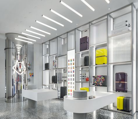 FRAME | Up, up and away: Rimowa’s NYC store prepares clients for smooth travelling Passport Photo Booth, Corian Stone, Soho Ny, Aluminum Shelves, Nyc Studio, Passport Photo, Opening A Boutique, Mirror Interior, Store Opening