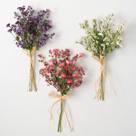 This trio of bushes, each tied off with raffia into handheld bundles, casts a color each on its own. One bright pink, one vibrantly violet, and another in a soft creamy ecru shade - this savvy selection provides a look that feels freshly picked from a wildflower field. Over the last 55 years, Sullivans has become an industry leader in home decorations. Our brand is rooted in tradition while incorporating modernized trends to keep your home looking up to date with timeless style. Here at Sullivan Flowering Bushes, Bridal Shower Balloons, Wildflower Baby Shower, Wildflower Field, Silk Plants, Flower Therapy, Freshly Picked, Project Runway, Faux Florals