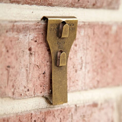 Hanging Pictures On Brick Wall, How To Hang Tools Guide Brick Clips, Famous Interior Designers, A Brick Wall, Exposed Brick Walls, Brick Walls, The Brick, Container Store, Celebrity Houses, Hanging Pictures