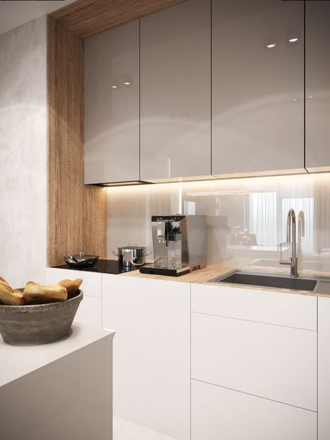 a minimal two tone kitchen with grey and white cabinets, with a neutral glass backsplash that adds a sleek feel to the space Glossy Kitchen, Kitchen Backsplash Trends, Simple Kitchen Design, Modern Kitchen Cabinet Design, Modern Kitchen Interiors, Kitchen Decor Modern, Kitchen Design Decor, Kitchen Room Design, Simple Kitchen