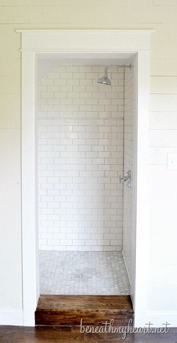 Our next project! we have a huge walk in closet in our bathroom to convert into shower like this...Subway tile dark grout shower. Shower In Cupboard, Shower Cupboard, Smallest Bathroom, Wood Tile Shower, White Subway Tile Shower, Laundry Cupboard, Kon Tiki, Doorless Shower, Subway Tile Showers