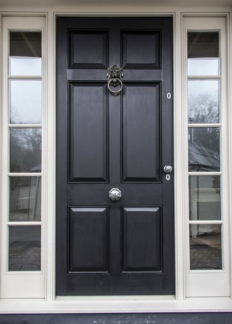 The exterior of your property should benefit from the same care and attention as the interior. Your front door welcomes family and guests and gives you an opportunity to reflect the style and feel within your home.  Our octagonal pewter knobs contrast brilliantly with the dark paint colour of this panelled door and the lion head door knocker in antique pewter finishes this classic look. Front Door Central Knob, Front Door With Door Knocker, Front Door With Knocker, Front Door Glass Panel, Dark Front Door, Apartment Front Doors, Front Door Black, Apartment Front, Pvc Doors