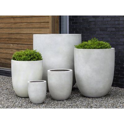 Features:While they are considered frost-resistant, these lightweight containers should be brought in during the winter and stored in a covered, frost-free location away from the elementsProduct Type: Pot PlanterLocation: Outdoor Use OnlyMaterial: FiberglassMaterial Details: Wood Construction Type: Wood Species: Subject/Theme: Color (Color: Riverstone Lite): Riverstone LiteColor (Color: Charcoal Lite): Charcoal LiteColor (Color: Ivory Lite): Ivory LiteShape: RoundDrainage Holes: NoDrill Holes: D Campania International, Fiberglass Planters, Clay Planters, Fleur Design, White Planters, Apartment Balcony, Living Things, Pottery Planters, Concrete Planters