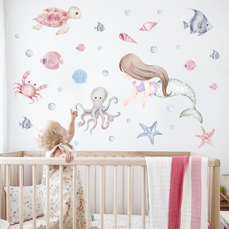 PRICES MAY VARY. ENCHANTING UNDERWATER MERMAID WALL DECAL: Immerse your little one in a whimsical journey beneath the waves with our captivating mermaid and ocean creature wall decals. Transform her room into an enchanting underwater wonderland, where her imagination can soar amidst vibrant designs that bring the ocean's beauty to life. SIMPLE TO APPLY: Crafted from eco-friendly materials, our wall decals offer a sustainable touch to your space. Effortlessly adhere to smooth surfaces, providing