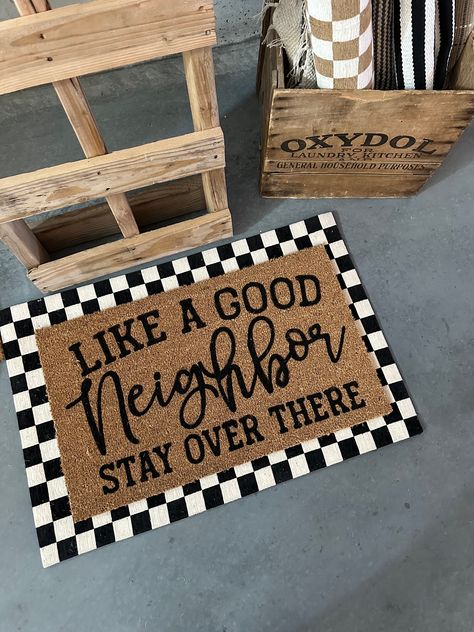 Introducing our "Like A Good Neighbor, Stay Over There" doormat - a humorous and socially distant greeting for your home. Crafted from high-quality materials, this doormat not only adds a touch of wit to your entrance but also sets the tone for respectful space. Keep it lighthearted while maintaining boundaries. Welcome guests with a smile and a subtle reminder to maintain a little distance. Diy Outdoor Mat, Maintaining Boundaries, Fromt Doors, Diy Doormat, Door Mat Diy, Sell Ideas, Doormat Funny, House Organisation, Funny Home Decor