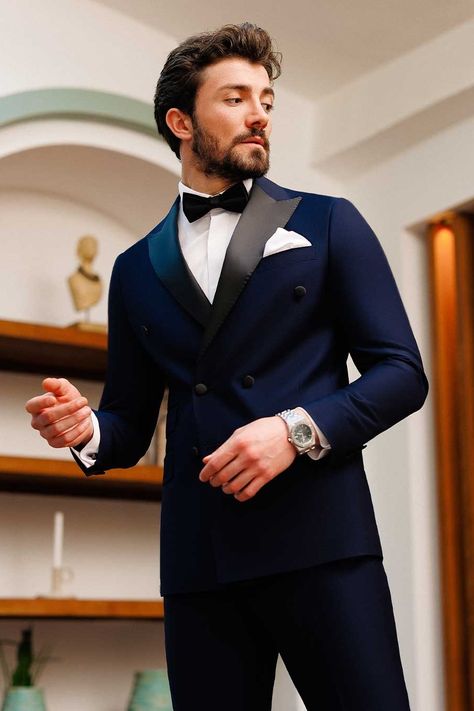 Embrace the classic allure of our navy double-breasted tuxedo 2-piece ensemble. With its commanding 6-button blazer, peak lapels, and double vents, this suit exudes elegance and ensures a polished and dapper look. #tuxedo #navytuxedo #groom #navyslimfittuxedo #elegantstyle #sophisticatedlook #formalattire #refinedluxury #weddingattire Mens Tuxedo Styles Formal Wear, Tucsido For Man, Navy Tuxedo Wedding, Tuxedo For Men Wedding, Indian Wedding Suits Men, Groomsmen Tuxedos, Navy Tuxedos, Wedding Kurta, Double Breasted Tuxedo