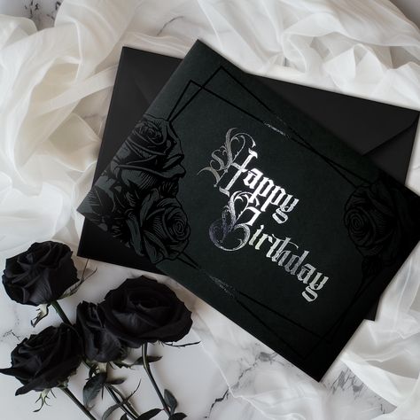 🥀 Handmade 🥀 Large A5 size 🥀 Envelope included 🥀 Blank inside to write your own personalised message Celebrate in style with our Black Rose Foiled Birthday Card, a stunning expression of dark elegance. Handmade with care, this landscape-format card features exquisite black foiled roses and intricate silver foiled Victorian text spelling out "Happy Birthday." Perfect for those who embrace gothic, emo, classic dark fantasy, and horror aesthetics, this card is a unique and thoughtful alternativ Gothic Birthday Party Invitations, Birthday Card Envelope Art, Gothic Birthday Card, What To Write In A Birthday Card, Dark Birthday Aesthetic, Emo Birthday, Dark Fantasy Horror, Horror Aesthetics, Goth Birthday