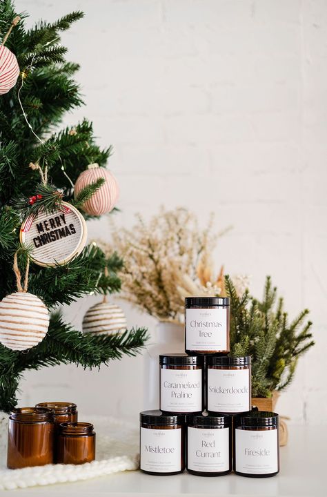 In today's blog post, I'm showcasing Earthside Candle Co's holiday and Christmas product photoshoot! Read on to see our studio setup & props. | Emily Kim Photography | christmas product photography, christmas product photoshoot, christmas product photography styling, christmas product photography ideas, christmas product shoot, candle photography, candle photography ideas, candle photography inspiration Christmas Photoshoot Ideas For Products, Christmas Packaging Photography, Christmas Tree Product Photography, Christmas Candle Product Photography, Ornament Product Photography, Christmas Candle Photography Ideas, Christmas Candles Photography, Christmas Candle Shoot, Christmas Ornaments Photography