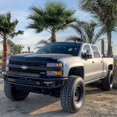 Up for sale is a stunning 2015 Chevrolet Silverado 2500HD LML Turbo diesel truck with professionally done modifications. It will perfectly handle towing, hauling, long road trips, desert trails and look awesome while doing all of that. Badass custom black front-end. Read more! #chevy #silverado #diesel #duramax #liftedtrucks Custom Silverado, Chevy Duramax, Silverado Truck, Trucks Lifted Diesel, Chevrolet Silverado 2500hd, Money Pit, Duramax Diesel, Truck Mods, Custom Chevy Trucks